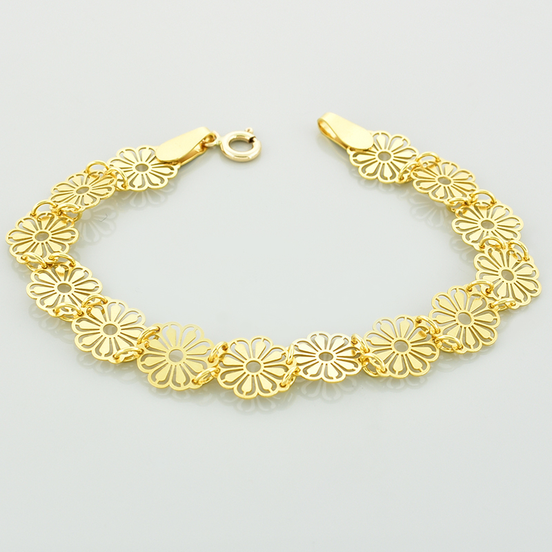 Złota bransoletka kwiatki wykonana ze złota we wzorze złożonym z ażurowych kwiatków.
